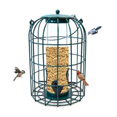 a bird feeder with two birds flying around it and another bird eating out of it