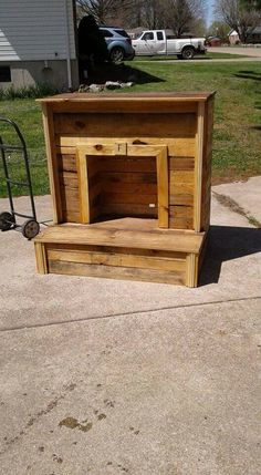 a wooden cabinet sitting on top of a sidewalk