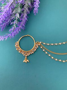 About 1.25 inch in diameter. Clear silver and chain. Gold-tone Alloy Chain Jewelry, Adjustable Alloy Chain Jewelry, Gold Hoop Alloy Jewelry, Gold Hoop Jewelry In Alloy, Gold Hoop Jewelry Made Of Alloy, Gold Alloy Ring, Gold Alloy Ring Jewelry, Gold Chain Alloy Jewelry As Gift, Gold Plated Dangle Chain Jewelry