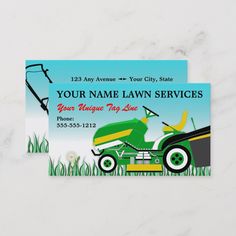 two lawn mower business cards sitting on top of a table