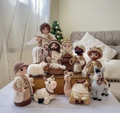 a group of crocheted nativity figurines on a table