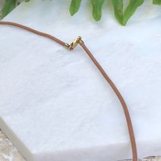 14KT yellow gold + brown tan leather cord necklace. Wear alone or add on a pendant to transform the necklace! 14k yellow gold fancy lobster clasp Cord width: 1.5mm Lengths available: 16", 18" Made in USA Adjustable Leather Necklaces For Everyday, Adjustable Leather Necklace For Everyday, Minimalist Jewelry With Gold Clasp, Minimalist Everyday Leather Necklace, Brown Necklace With Sliding Knot For Gift, Adjustable Yellow Gold Initial Pendant Charm Necklaces, Adjustable Yellow Gold Initial Pendant Charm Necklace, Minimalist Leather Jewelry With Adjustable Cord, Leather Jewelry With Adjustable Cord For Everyday Use