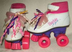 two roller skates with pink and purple wheels