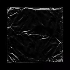 an image of a black background that looks like it has been wrapped in plastic paper