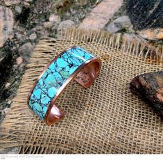 * King Man Turquoise Inlay. Black Matrix light blue. * 2.7 mm X 20 mm Thick and Wide. * Polished and Waxed. * Blue and Black Matrix Turquoise. Mark your color on the option. * Measure your whole wrist tightly on the wrist bone and mark it on the option. Adjustable Artisan Blue Bangle, Turquoise Patina Cuff Bracelet As A Gift, Turquoise Cuff Bracelet With Patina As A Gift, Artisan Handmade Blue Bangle, Turquoise Bracelet With Patina As A Gift, Blue Patina Cuff Bracelet As Gift, Blue Patina Cuff Bracelet As A Gift, Blue Cuff Bracelet With Patina As A Gift, Blue Cuff Bracelet With Patina For Gifts