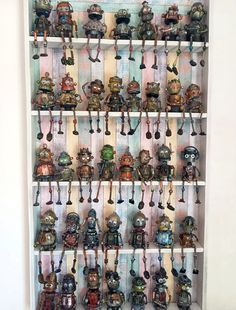 a shelf filled with lots of different types of figurines on it's sides