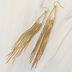 These Long N Lush Tassel Earrings Are Chic And Glamorous! They Demand A Night Out On The Town In A Cocktail Dress Or A Tuxedo Jacket And Jeans. 18 Kt Gold Filled Tassels Cascade From A Diamond Shape On Wire Hooks. The Length Lightly Dusts The Bottom Of The Neck. Handmade. Gold Tassel Earrings With Fringe For Evening, Long Drop Fringe Tassel Earrings, Gold Fringe Chandelier Earrings As Gift, Chic Tassel Earrings With Fringe For Gift, Chic Tassel Earrings With Fringe As Gift, Gold Fringe Tassel Dangle Earrings, Gold Dangle Tassel Earrings With Fringe, Gold Dangle Tassel Earrings, Tuxedo Jacket