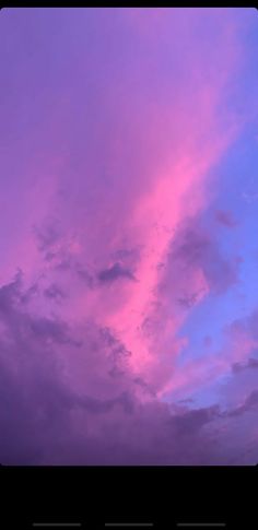 the sky is pink and blue with clouds