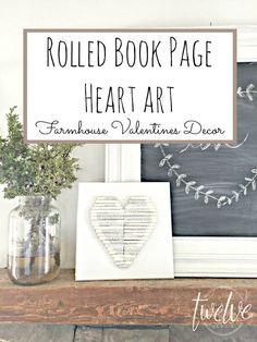 a sign that says rolled book page heart art on top of a mantle with flowers