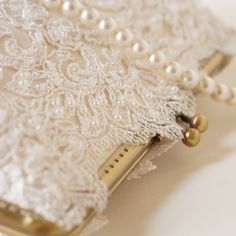 • Ivory Capri Clutch • Elegant Cream Bridal Accessories, Elegant Bridal Accessories With Pearl Embroidery For Ceremony, Elegant White Bridal Accessories For Wedding, Pearl White Clutch For Wedding, Gold Clutch With Pearl Handle For Wedding, Elegant Beige Wedding Clutch, Lace Bridal Accessories For Ceremony, Formal Lace Bridal Accessories, Elegant White Bridal Accessories For Mother Of The Bride