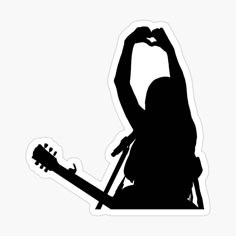 the silhouette of a person holding a guitar sticker