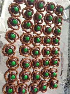 some pretzels with green and brown decorations on them