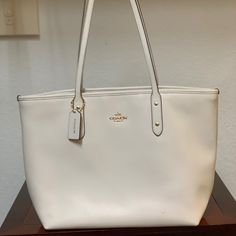 Chalk White Color Pre-Owned In Great Condition Details Crossgrain Leather And Coated Canvas Inside Zip, Cell Phone And Multifunction Pockets Zip-Top Closure, Fabric Lining Handles With 10" Drop 11 3/4" (L) X 10 1/2" (H) X 5 1/2" (W) Coach White Leather Bag, Coach Dempsey Tote 22 White, Reversible Tote Bag, Coach Tote Bags, Beige Bag, Red Tote, Pink Tote Bags, Coach Tote, Zip Tote