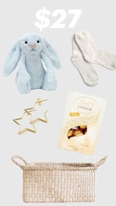 the contents of a baby's gift set including socks, teddy bear and diaper