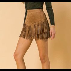 Faux Suede Mini Skirt With Double Layered Suede Fringe Tassels In Front/Back. Model Is 5'8" Wearing A Size Small Approx. Waist 14" Length 15" (Measurements Taken From Size Medium) Care Instructions: Hand Wash Winter Mini Skirts, 2024 Clothes, Red Leather Skirt, Back Model, Beaded Skirt, Belted Mini Skirt, Checkered Skirt, Faux Leather Mini Skirt, Suede Mini Skirt