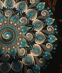 an intricately designed plate with blue and white designs on it