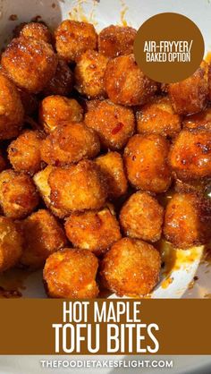 a bowl filled with tater tofu bites covered in sauce and topped with an air fryer bake option