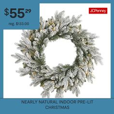 a christmas wreath is shown with the words nearly natural indoor pre - lit christmas wreath