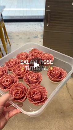 someone is holding up some food in a plastic container with the words salami rose on it