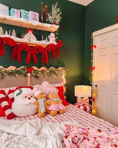 a bedroom decorated for christmas with green walls