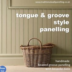 a basket sitting on top of a table next to a wall with the words tongue & grovee style paneling