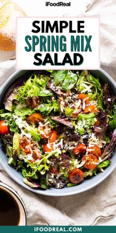 a salad with tomatoes, lettuce and cheese on top