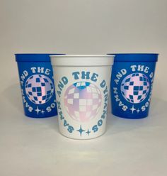 three blue and white cups with the words around the world printed on them are sitting next to each other