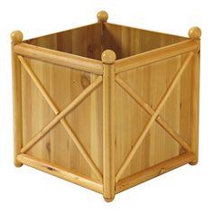 a wooden planter with two handles on each side