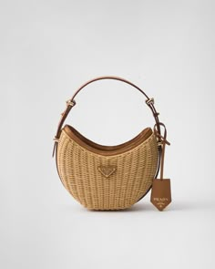 Natural Wicker And Leather Prada Arqué Bag | PRADA Chic Luxury Basket Shoulder Bag, Prada Bags, Trending Bags, Designer Bags, Luxury Basket-shaped Everyday Bag, Designer Natural Basket-shaped Bags, Prada Wicker Bag, Luxury Women's Basket-shaped Shoulder Bag, Luxury Bags Collection