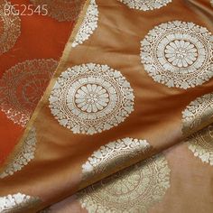 Brown Brocade Victorian Costumes Banarasi Indian Fabric by the Yard for Wedding, Dinner, Cocktails Dresses Coats Jacket Home Decor Valances. This is a beautiful banarasi blended silk brocade mandala design fabric in Brown and Gold. ➤Product: Brocade Fabric ➤Fabric Type: Blended Silk (Viscose and Silk) Fine quality Zari Brocade Weaving from Banaras ➤Color: Brown and Gold ➤Width: 44 inches. ➤Condition: New ➤ Code: bg2545 ➤Listing for 1 Yard of fabric. ➤Care: Dry Clean Only You can use this fabric to make Dresses, Tops, Blouses, Jackets, Crafting, Clutches or Evening Bags, embellish your clothes, Pillows, Drapery, Home Décor, Outdoor, Quilting, Sewing, General, Upholstery etc use it for scrap booking projects. If you purchase more than 1 Yard, you will get it in running length, not in pieces. Cocktails Dresses, Dinner Cocktails, Dresses Coats, Banarasi Brocade, Victorian Costume, Indian Fabric, Silk Brocade, Wedding Dinner, Design Fabric