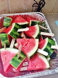 watermelon and radishes are cut up in pieces on a platter