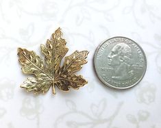 Lovely 24k gold plated brass maple leaf attached to a tack pin with a pinch-back clasp to create a lovely brooch/lapel pin.  This piece has been antiqued to show the wonderful detail.  Beautiful on a jacket, hat, or lapel.  Highly detailed, woodland accessory.   Maple leaf measures 1 5/8" wide x 1 5/8" long.Choose a masculine gift box or a feminine gift box for your order from the drop down.Your order will be shipped in two business days.  Every piece is handcrafted in my home jewelry studio and Canada Nature, Garden Boho, Nature Fall, Feminine Gifts, Fall Forest, Forest Garden, Gold Brooch, Jewelry Studio, Gold Brooches