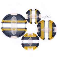 three woven coasters with yellow and black stripes