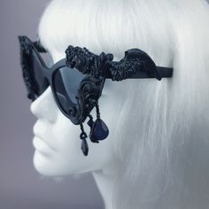 Hand-decorated black filigree ornate sunglasses dripping with beading. Please note: There is no ready-made sunglasses box large enough for these sunglasses. These sunglasses are wearable art and need to be treated with due care. While i have taken every possible care to make them sturdy throwing them in a bag careless may damage them. Treat them as you would a precious thing... Approx measurements: Inner arm to arm: 13cm Total width: 16cm Approx Weight: 42g Thank you in advance for not PM'ing me Black Glass Sunglasses For Festival, Gothic Black Sunglasses For Party, Black Gothic Sunglasses For Party, Vintage Black Sunglasses For Festival, Dark Beauty Magazine, Sunglasses Box, Uv400 Sunglasses, Black Lipstick, Goth Wedding