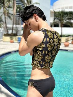 Elevate your beach style with our sleek and elegant men's Gold Baroque crop tank top, designed to perfectly complement Maris Equi swimshorts and swim briefs. Crafted for comfort and style, this coordinated ensemble is your go-to choice for beachside adventures or poolside lounging. Our men’s tank tops are made after you order. Allow 9 to 12 days for delivery. If you also order swim briefs, the tank will ship separately. This tank top has a unique and sexy drape over your torso. Pay attention to Swim Brief Beach Men, Men’s Lingerie, Male Lingeniere, Rome Fits, Male Swimwear, Beach Episode, Swim Tank, Gay Outfit, Gold Baroque