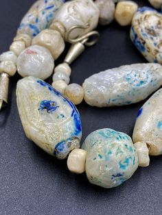 The Rare and Unique Beads necklace of Ancient Rough Rock Crystals Almost every Bead is Beautifully Carved and Beautifully painted with Blue color Rare and unique Item for collection Fast and Free shipping service Artistic Beaded Necklace With Large Beads, Artistic White Round Beads Jewelry, Artistic White Round Bead Jewelry, Artistic White Round Beaded Jewelry, Artisan Single Strand Czech Glass Beaded Necklace, Artisan Single Strand Czech Glass Beaded Necklaces, Artisan White Single Strand Beads, Artisan Czech Glass Large Beads, Artisan Large Czech Glass Beads