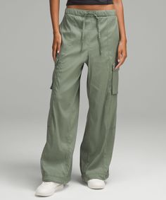 One Pant, Two Looks. These Lightweight, Baggy Cargo Pants Can Be Worn Straight Or Cinched At The Bottom For A Tapered, Jogger-Like Fit. Designed For Casual. Full Length Intended To Sit At Ankle:oversized Fit Is Exaggerated And Feels Extra Roomy. Hand Pockets With Hidden Card Sleeve. Cargo Pockets. Pull And Tie The Drawcords At The Hems To Change The Shape. Elasticated Waistband With Adjustable Drawcord. | Lightweight Adjustable Mid-Rise Cargo Pant Baggy Cargo Pants, Card Sleeve, Pants Design, Cargo Pant, Cargo Pants Women, Lululemon Women, Bottom Clothes, Long Tops, Short Tops