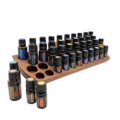 This display is ideal for anyone who uses oils with a 15ml bottle content (diameter 29 mm) and also bottles with a 5ml content (diameter 24 mm). It has space for 29 oil bottles (diameter 28 mm) and 11 spaces for 5ml bottles (24 mm). The staggered arrangement means you can read each label easily. The stand for oils is slightly slanted at the front. This improves handling and overview, and also looks incredibly chic and elegant. - Display for AromaTouch technology - Shelf for essential oils - hand Walnut Oil, Different Textures, Oil Bottle, Beauty Essentials, Doterra, Color Shades, Walnut Wood, Natural Materials, Unique Pieces