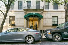 two cars parked in front of a building