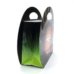 a black and green paper bag with flames on the front is open to show it's inside