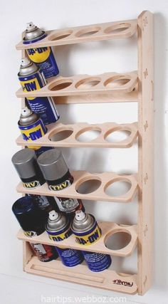 a wooden rack with cans and cans on it