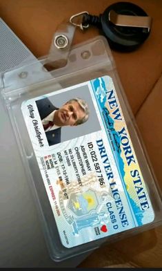 a new york state id with a keychain attached to it