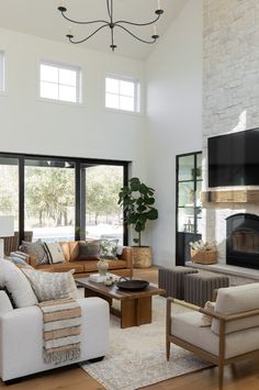 a living room filled with furniture and a fire place