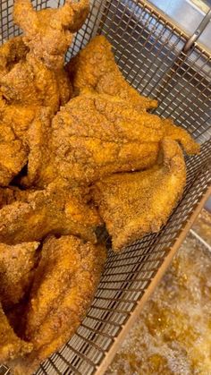 some fried food is in a metal basket