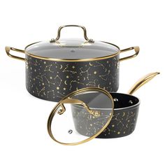 two pots with gold stars on them and one has a glass lid in the middle