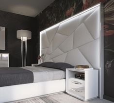 a bedroom with a bed, night stand and nightstand in white color on the wall