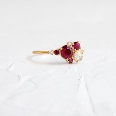 Round ruby focal (5mm, SI clarity). Side cluster stones ranging from 1.5mm to 3.5mm, SI1 clarity, G+ color round and round rose cut diamonds, AA round natural rubies. Solid 14k gold setting with a delicate 1.2mm round band. Also available in platinum. We handcraft each piece with responsibly sourced metals and ethically sourced stones. Melanie Casey, Basket Setting, Stone Feature, Stone Work, Natural Ruby, Rose Cut Diamond, Gold Set, Cluster Ring, Rose Cut