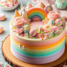 there is a cake decorated with rainbows and flowers