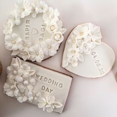 wedding cookies decorated with flowers and hearts