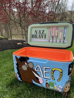 an ice chest is sitting in the grass